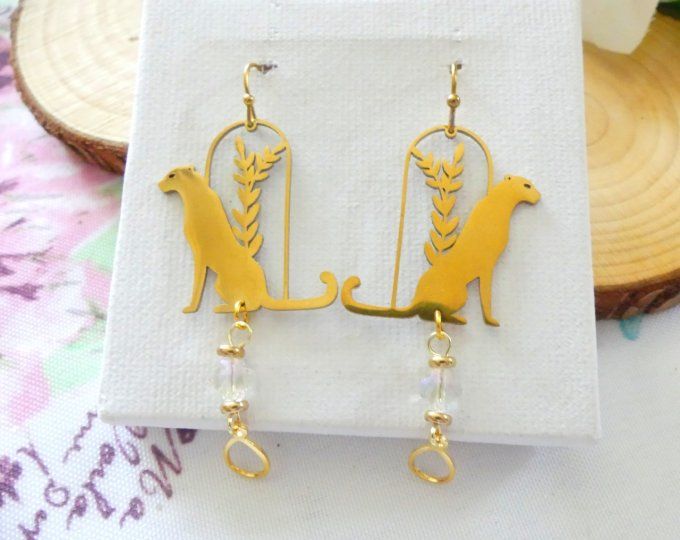 Boucles d'oreilles panthère en acier doré et perles de cristal
